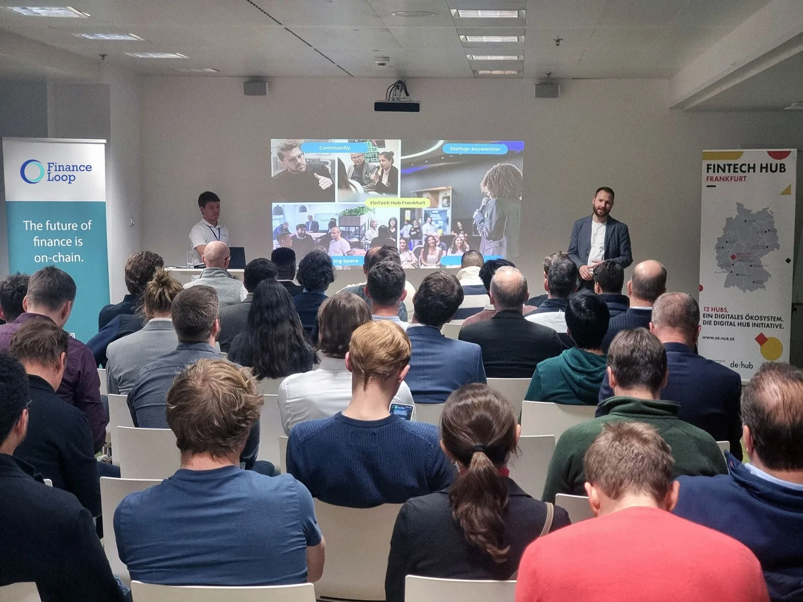 A talk in front of a full room at a business meetup in Frankfurt